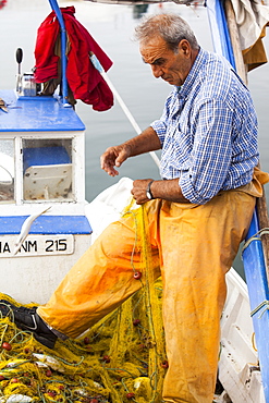 Sustainably caught fish in a net onboard a small traditional Greek fishing boat in Myrina harbour, on Lemnos, Greek Islands, Greece, Europe