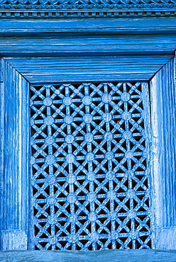 An intricately carved window in the old traditional village of Ghandruk in the Nepalese Himalayas, Nepal, Asia