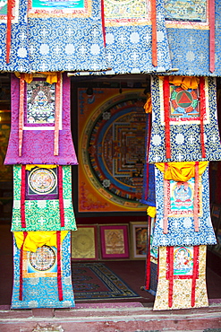 A shop selling traditional Buddhist Thanka paintings in Boudhanath Stupa square, Kathmandu, Nepal, Asia