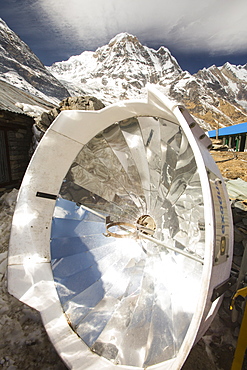 A solar cooker for baking bread at Annapurna Base Camp, Himalayas, Nepal, Asia