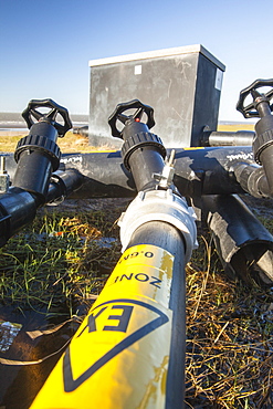 Methane being extracted from an old landfill site on Walney Island, to power a biogas generator producing green electricity, Cumbria, England, United Kingdom, Europe