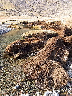 Huge chunks of peat eroded from the side of the Upper Esk by extreme flooding in the Lake District, Cumbria, England, United Kingdom, Europe