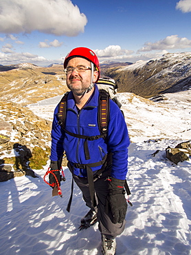 A climber in Custs Gully on Great End, a grade one winter route, Lake District, Cumbria, England, United Kingdom, Europe