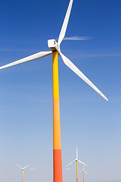 Colourful wind turbines in polders, reclaimed land near Almere, Flevoland, Netherlands, Europe