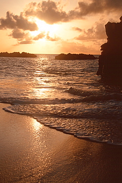 Waves and sunset at Waimea Bay, North Shore, Oahu, Hawaii, United States of America, Pacific