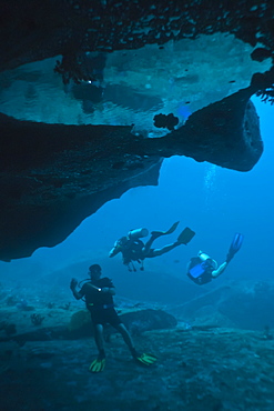 Scuba divers in underwater cave, Southern Thailand, Andaman Sea, Indian Ocean, Asia