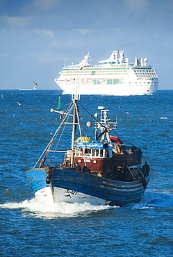 11/04/2009. Entering Casablanca Harbour, passing a local fishing vessel and cargo ship in background. . Casablanca, Atlantic Ocean, Morocco