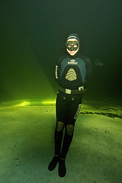 Freediving under the ice in Northern Russia in the White Sea. White Sea, Russia