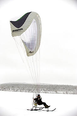 Olof Heikka a sami reindeer herdsman  on his paramotor. Lapland