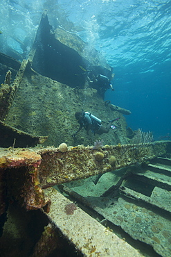 Diver diving on ship wreck in the Turks and Caicos Islands, West Indies, Central America