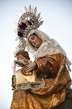 The Virgen del Carmen on her float that will take her to the Santuario near Tarifa in the evening of her excursion to sea, Tarifa, Cadiz, Andalusia, Spain, Europe