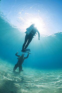 Scuba diving instructor and student completing hovering skills in shallow water, Naama Bay, Ras Mohammed National Park, Sharm El Sheikh, Red Sea, Egypt, North Africa, Africa