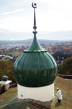 On the roof of a Mosque in Kampala, you can see suburbs in the background.  Well maintained and regularly painted. Kampala, Uganda, East Africa