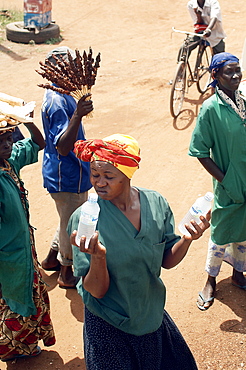 On the road to Kampala, there are numerous opportunities to purchase food, water and even live chickens at various trade spots along the way.  You don't even need to get off the bus. Northern Uganda, East Africa