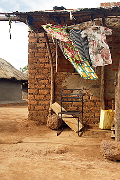 One of the more substantial dwellings in Te-Tugu IDP camp, made from bricks and even has a veranda.  An IDP camp (internally displaced people) in Te-Tugu district of Northern Uganda has been created to accommodate the mass of Ugandan refugees fleeing the LRA (Lords Resistance Army) who are fighting the Ugandan government and its people. Te-Tugu, Uganda, East Africa