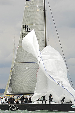 Action dropping the Spinnaker at Skandia Cowes Week 2008 Finish Line