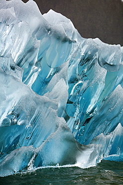 Deeply blue iceberg calved from the LeConte Glacier just outside Petersburg, Southeast Alaska, USA. Pacific Ocean.