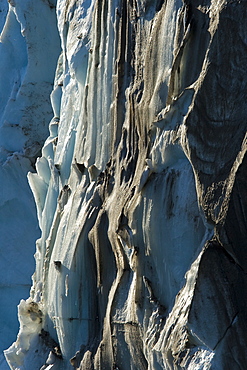 A detailed late evening view of the Negrebreen Glacier melting in the sunlight on Spitsbergen Island in the Svalbard Archipelago, Barents Sea, Norway.