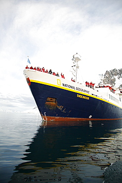 The National Geographic Endeavour pushing through brash ice and small icebergs in the Lemaire Channel near the Antarctic Peninsula.