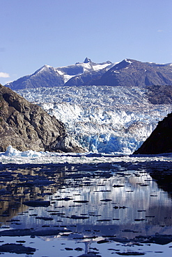 Sawyer Glacier with icebergs/bergy bits calved off in Tracy Arm, Southeasat Alaska, USA. Pacific Ocean.