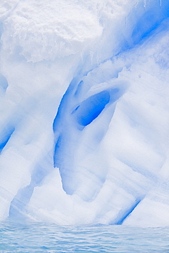 Iceberg detail in and around the Antarctic Peninsula during the summer months. More icebergs are being created as global warming is causing the breakup of major ice shelves and glaciers.