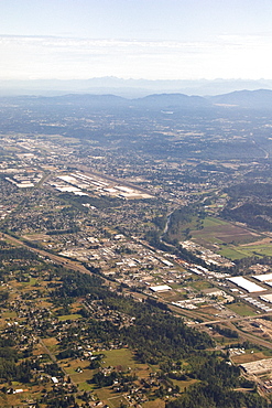 Views of the approach to Seattle, Washington area from a commercial airline, USA. Pacific Ocean.