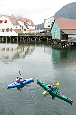 Kayaking in the slough in the small town of Petersburg in Southeast Alaska, USA. Pacific Ocean. No model or property release available for this photograph.