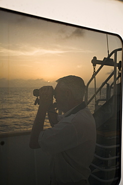 Sunrise or sunset at sea in the Atlantic Ocean from onboard the National Geographic Endeavour crossing the Atlantic Ocean from Lisbon, Portugal to Salvador, Brazil.