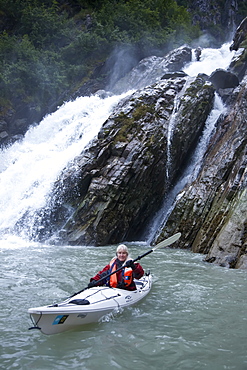 Staff member Lee Moll from the Lindblad Expeditions ship National Geographic Sea Bird kayaking in Southeast Alaska, USA. No model or property releases available for this image.