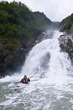 Expedition leader David Cothran from the Lindblad Expeditions ship National Geographic Sea Bird kayaking in Southeast Alaska, USA. No model or property releases available for this image.