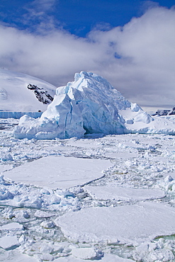 The Lindblad Expeditions ship National Geographic Explorer pushes through ice in Crystal Sound, south of the Antarctic Circle, Antarctica, Southern Ocean