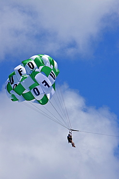 Commercial parasailing operations off the west side of the island of Maui, Hawaii, USA. MORE INFO Parasailing in Hawaii is limited seasonally to times of the year when humpback whales are not present.