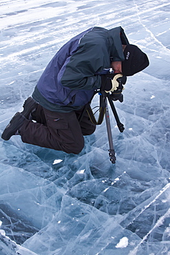 Canadian photographer Gilles Pucheu at work near his home in Yellowknife, Northwest Territories, Canada. MORE INFO Model release number GP032810.