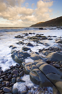 Rocky North Sea foreshore at dusk, Scottish borders, Scotland