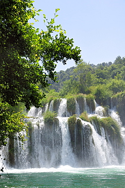 Mist rising from Skradinski buk waterfalls with densely  forested surrounds, Krka National Park, Sibenik, Croatia, Europe